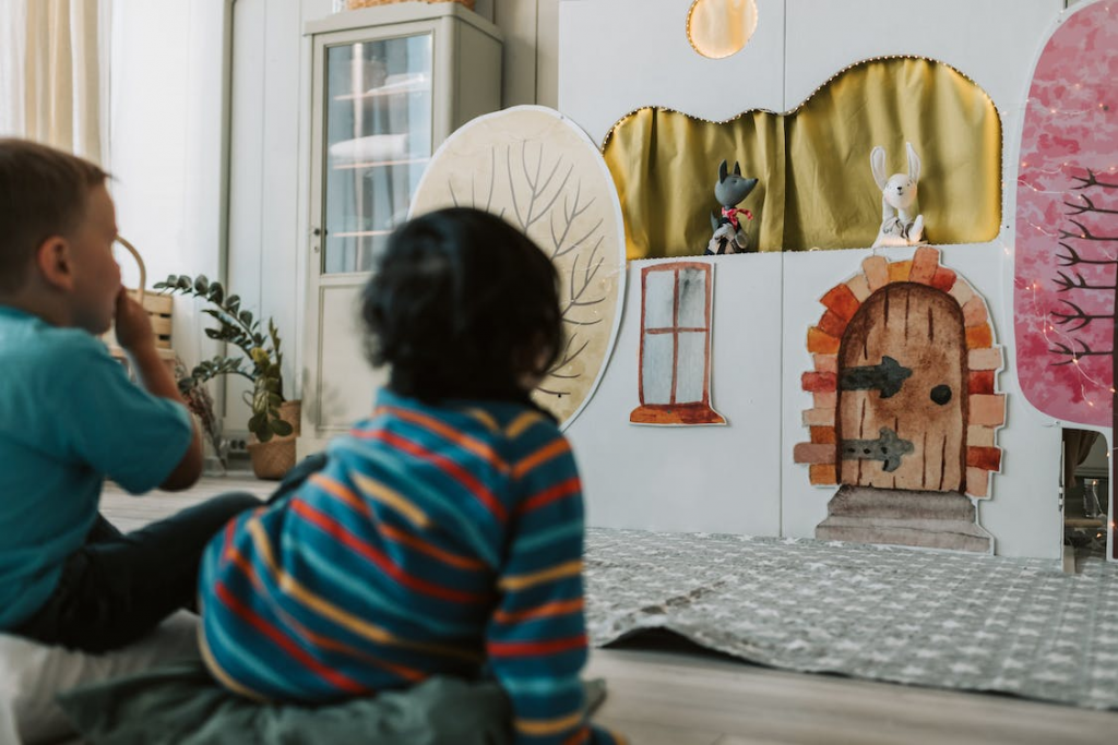 Children watching a puppet show