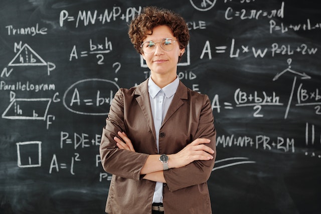 whatismentalmath Teacher standing in front of blackboard with math equations