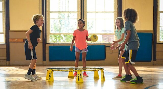 Children playing with a ball in the gym