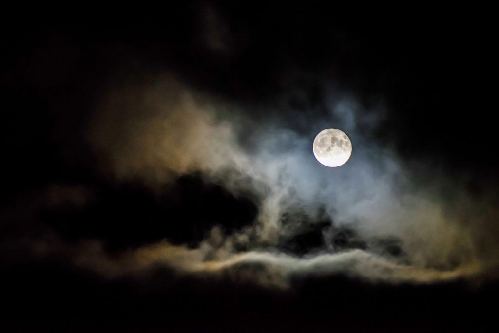 funhalloweentriviaforkids A bright full moon stands out against a dark sky