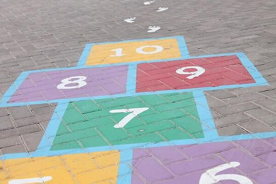 Colorful hopscotch pattern on a sidewalk