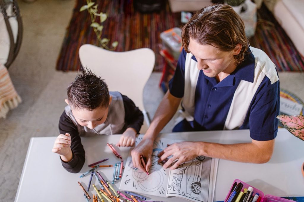 Father showing his son how to draw