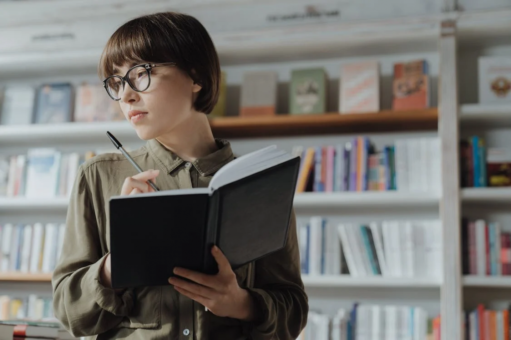 oldmathvsnewmathexplained Woman in library thinking of ideas