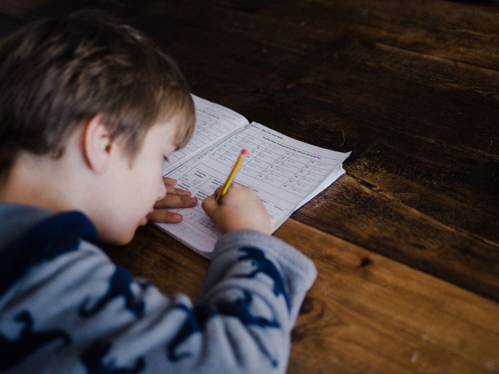 A boy working on a worksheet