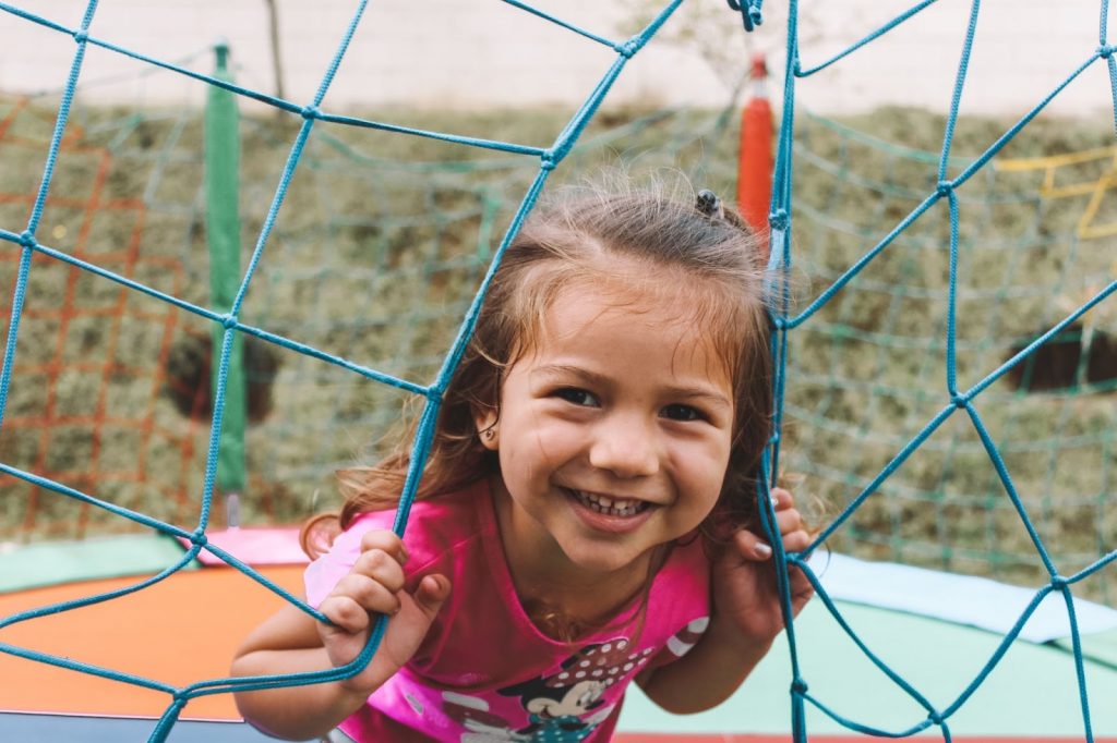 Happy girl on a trampoline in the park