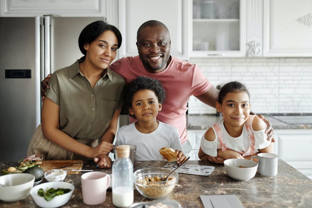 Family in the kitchen cooking dinner together