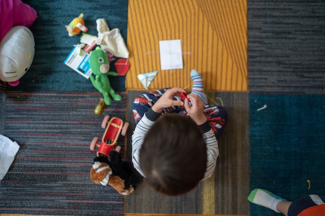 Child focusing on DIY game tasks