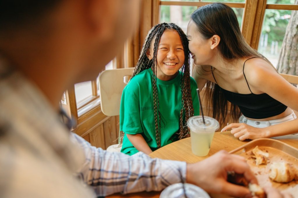 A mother and daughter laugh together