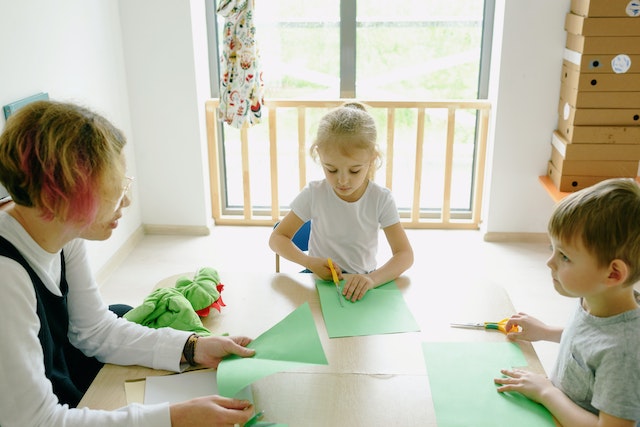 Family making hand made cards and gifts