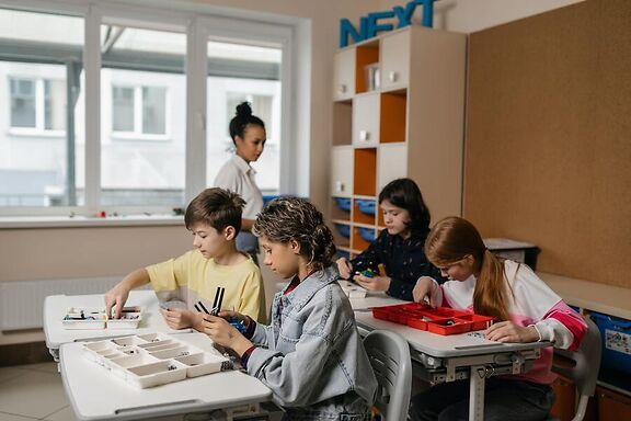 Children working on math project in class