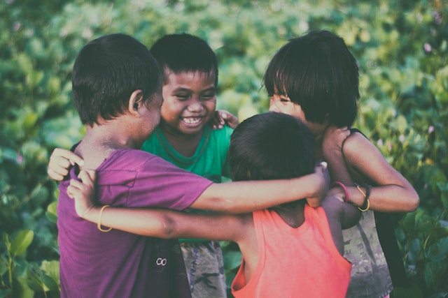 Kids forming a circle and playing