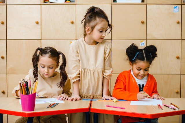 Children participating in arts crafts activity