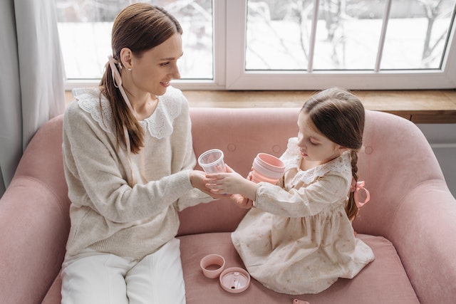 Mother using playtime to discuss behavior