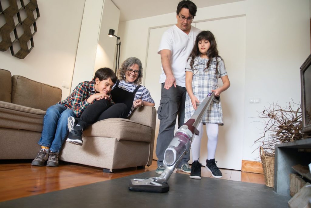 Parents teaching kids to clean