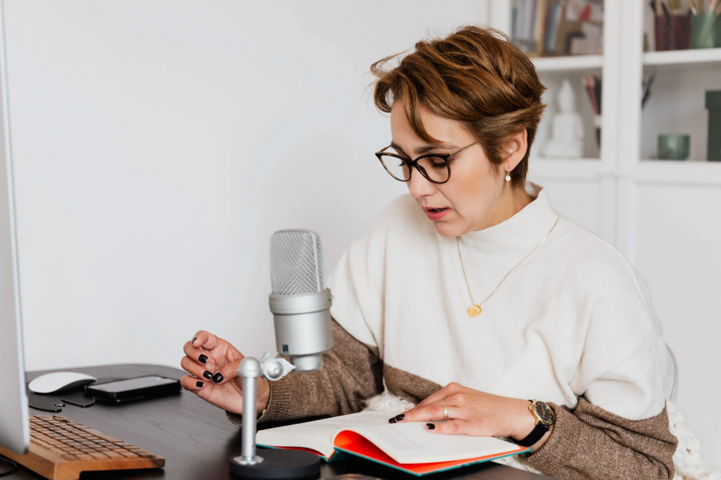 Woman narrates a story into a microphone