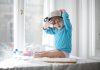 Little girl playing with pan and flour in kitchen