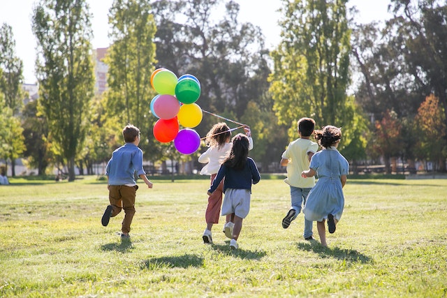 A large group of children participating in running activities