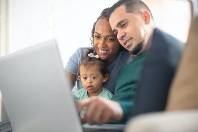 A family looking into a laptop screen