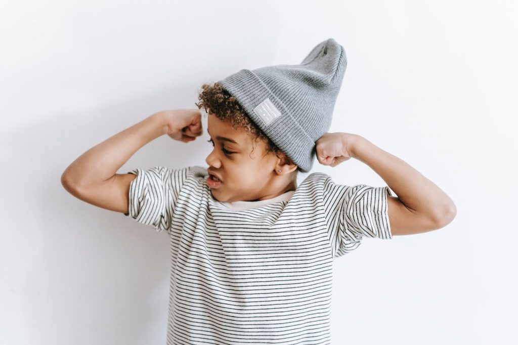 Little boy demonstrating strength