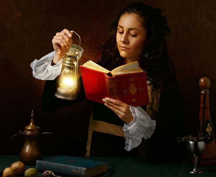 A woman from Victorian era reading a book