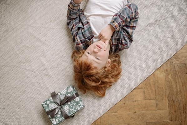 Boy lying on the floor and thinking