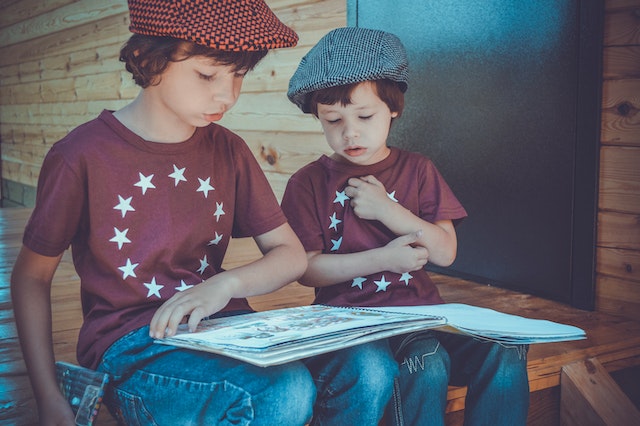 Boys reading 2nd grade book