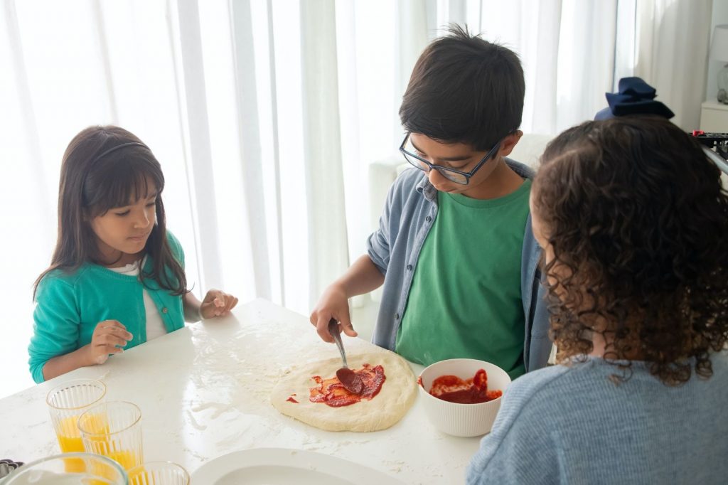 Children Making Pizza Together