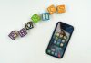 How to Get Best Results While Teaching Phonics to Kids at Home – A Step By Step Guide The word ‘phonics’ written using wooden blocks and phonics games and apps displayed in phone