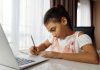 Child working on homeschool assignment