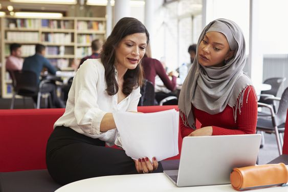 Teacher having a discussion with one of the parents