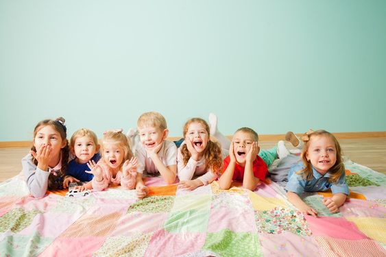 Laughing kids laying on the floor