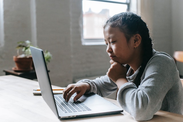 Child using technology for homeschooling