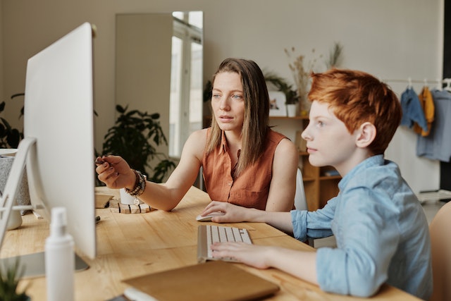 Mom teaching kid at home