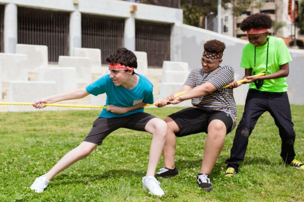 Group of boys playing tug of war