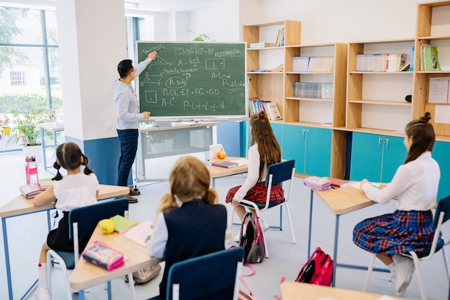 Teacher educating students in class