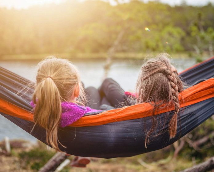 Two girls together in a hammock