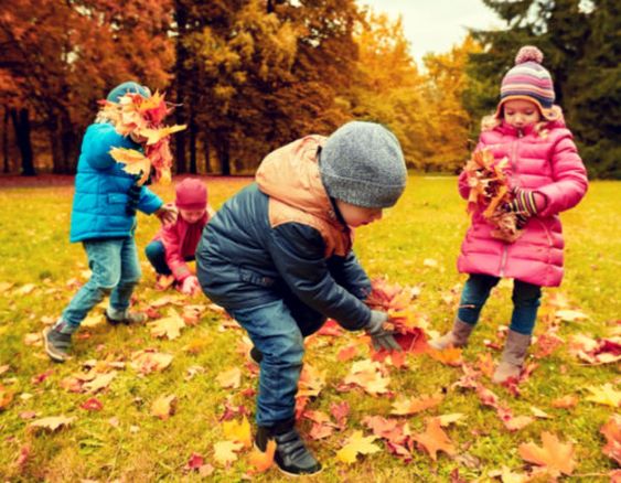 Kids playing with leaves