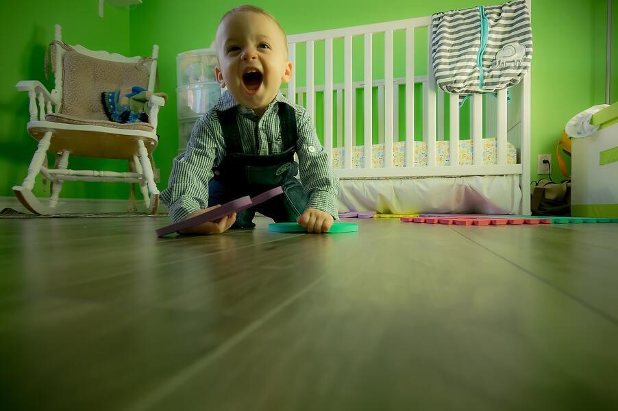 A little boy crawling on the floor