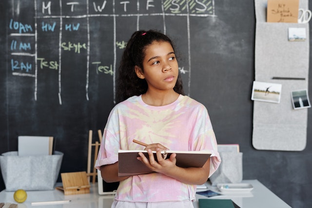 Child setting her schedule and weekly routine