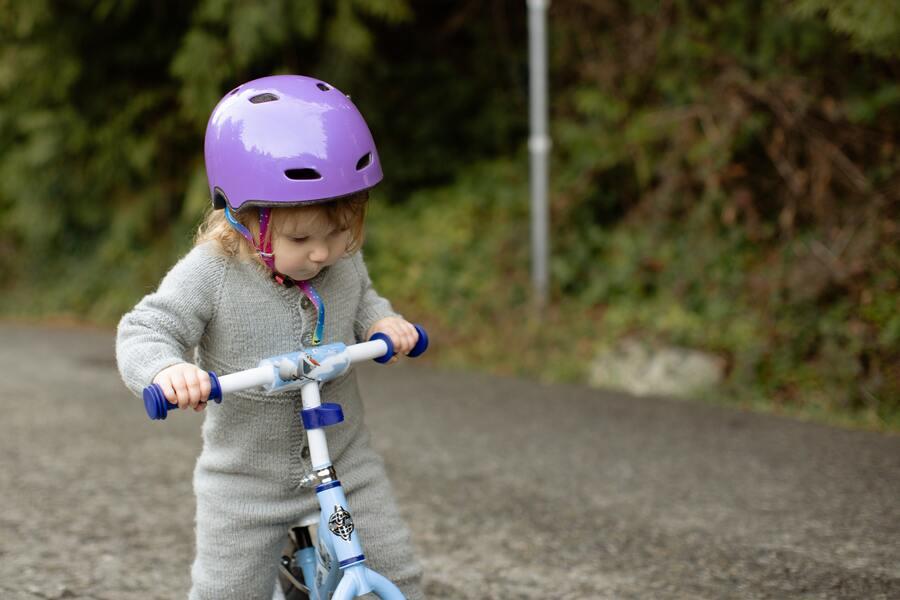 A little child riding a cycle