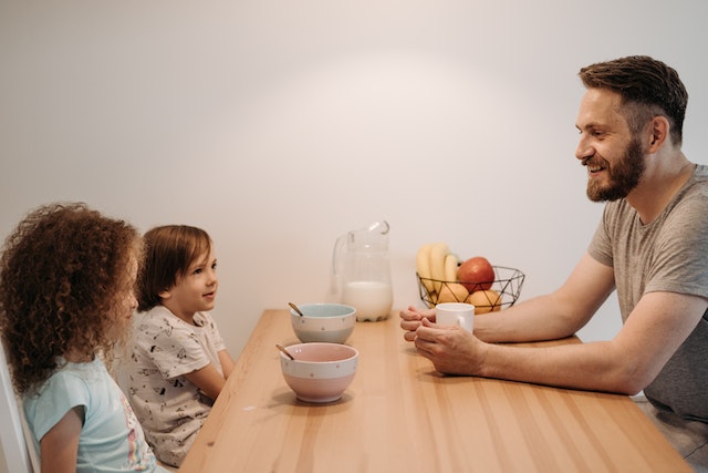 Father talking to his kids through fun filled questions