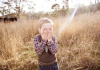 Child laughing in the fields