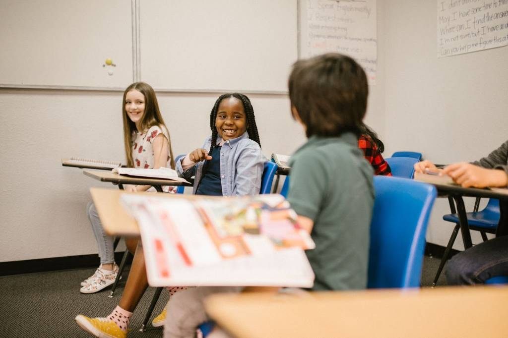 Kids laughing in a classroom