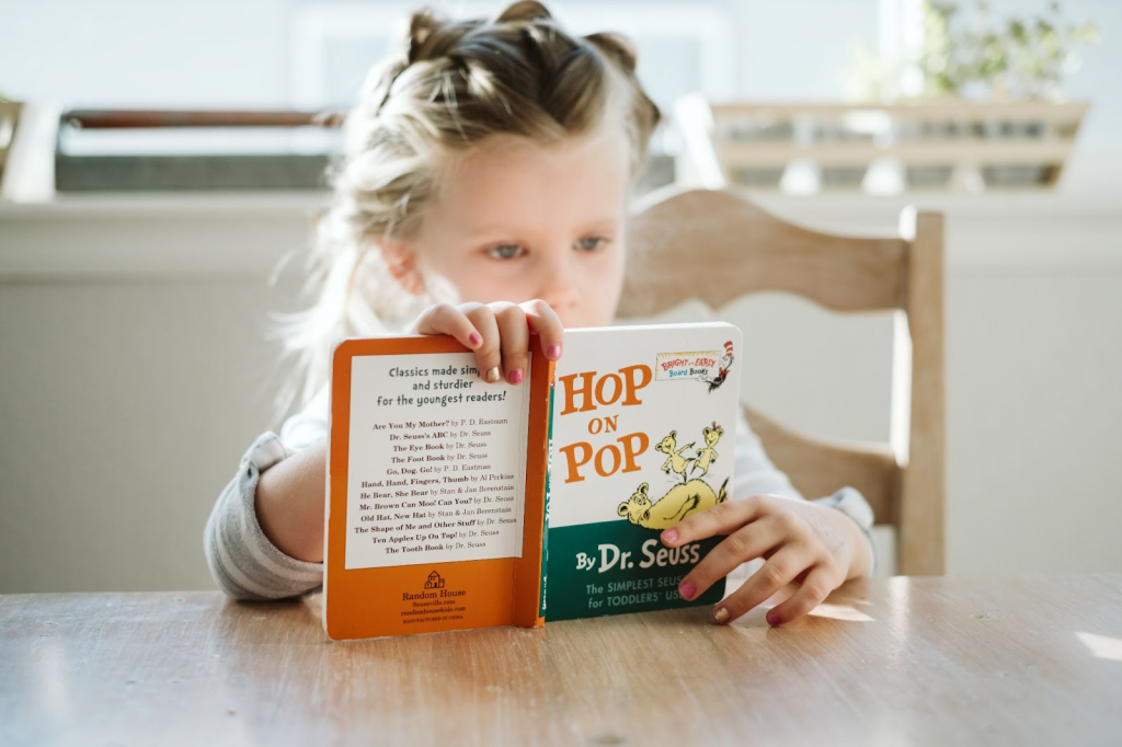 Girl sitting and reading a book