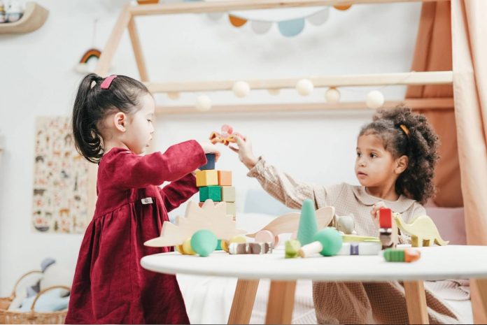 Girls Playing With Wooden Blocks