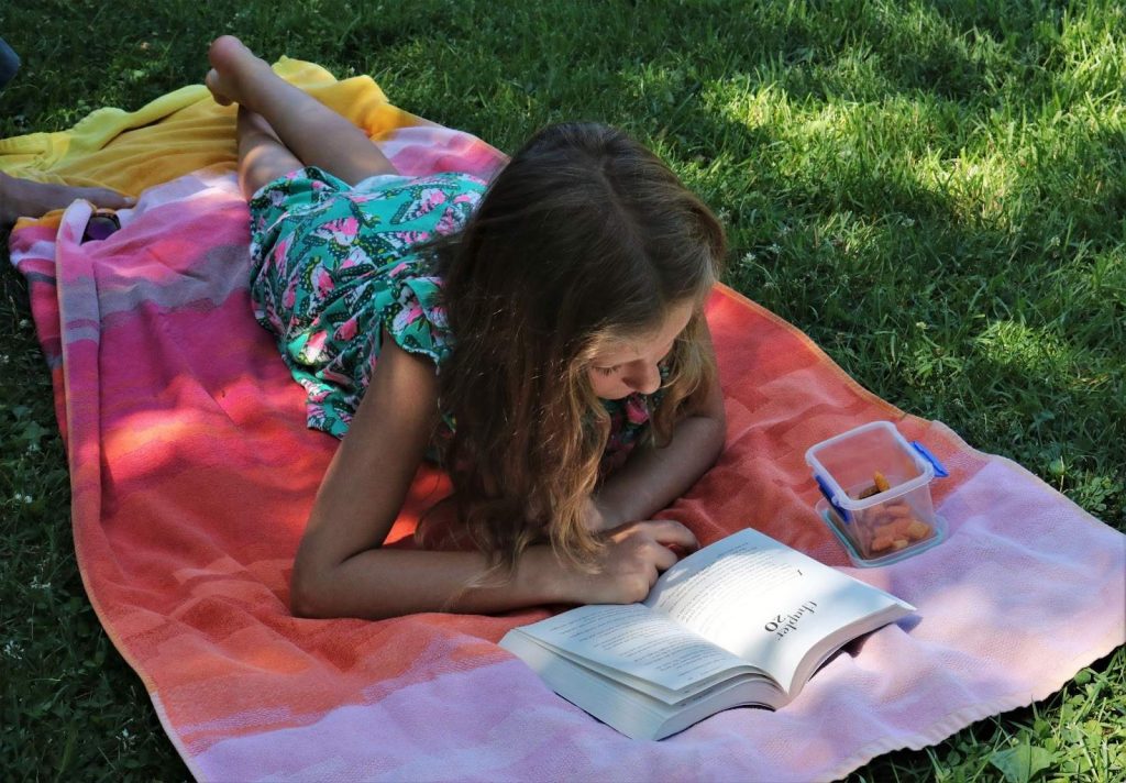 Girl reading in a garden