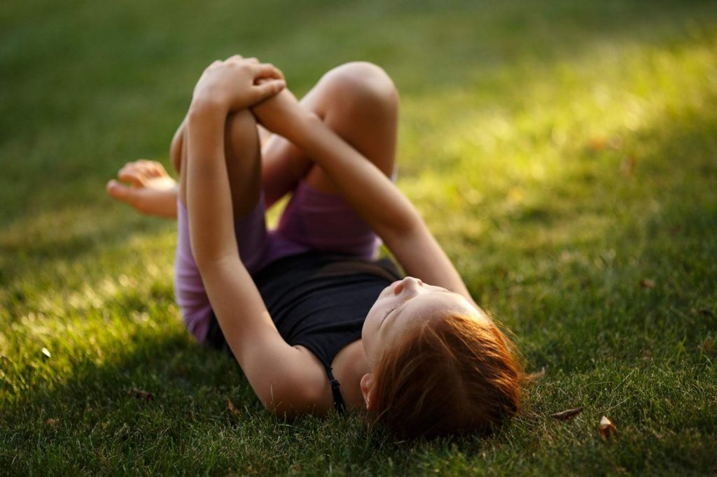 Girl relaxing on grass