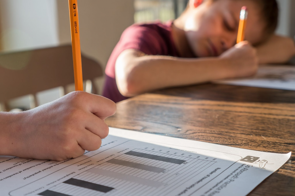 Kid holding pencil