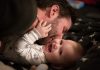 Father kissing his baby