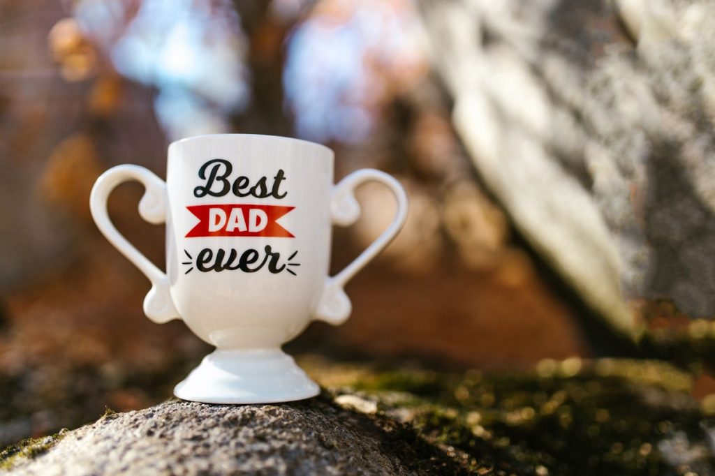 A trophy cup with best dad ever printed on it